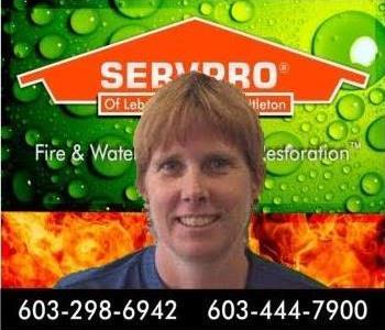 head shot of woman in front of SERVPRO background
