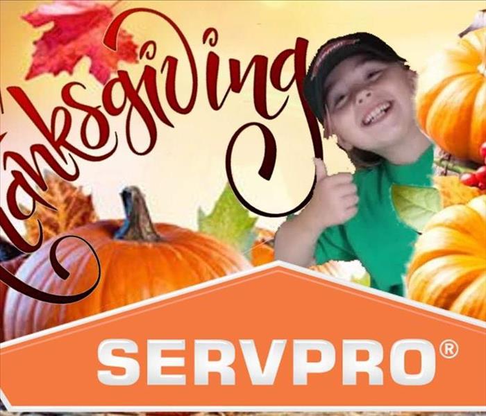girl giving thumbs up on SERVPRO happy thanksgiving poster